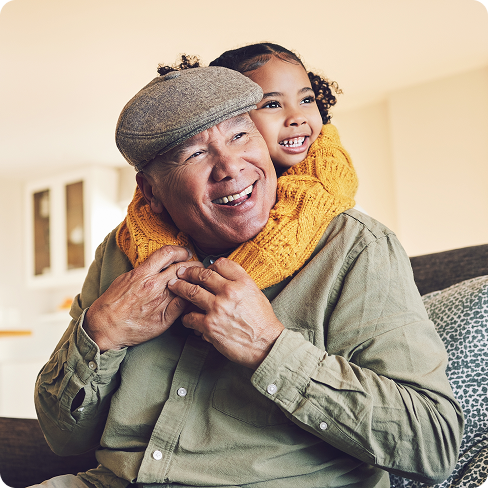 A father and daughter smiling