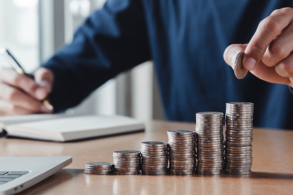 person stacking coins