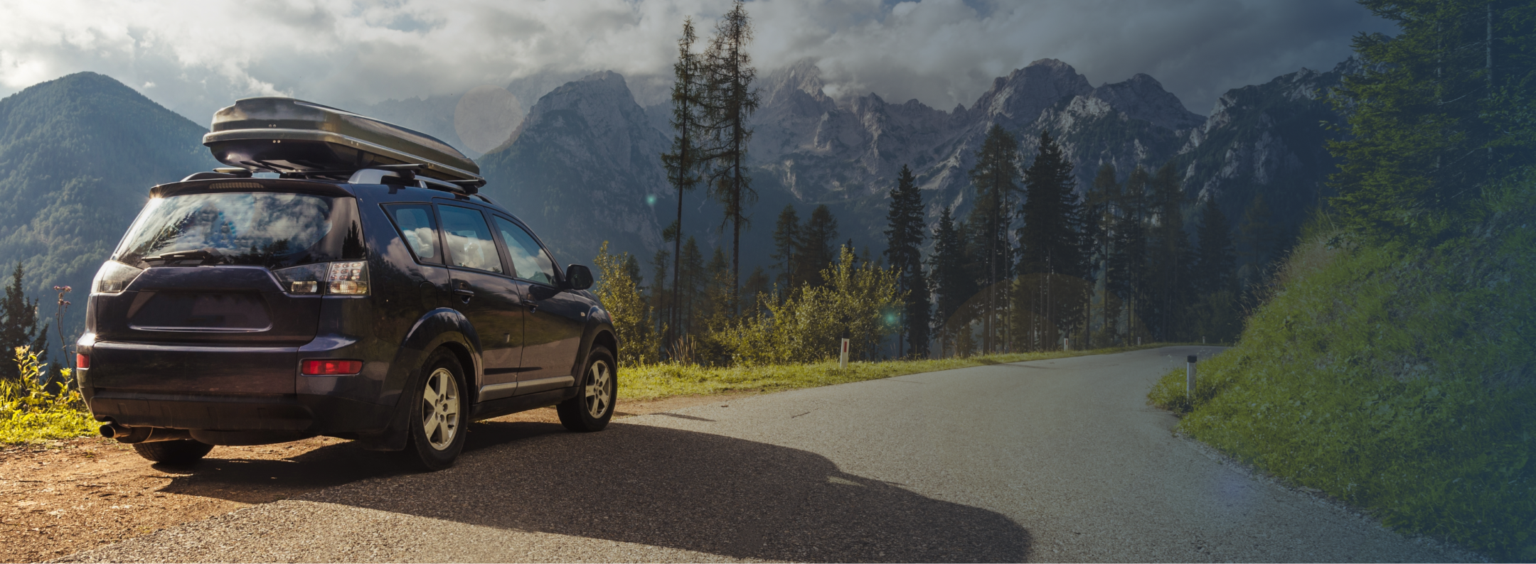 a vehicle on a road on a sunny day
