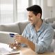 man checking card