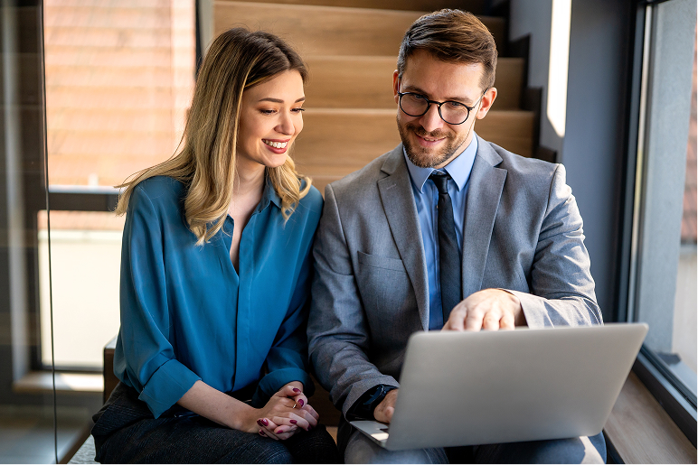 woman with glasses looking at phone
